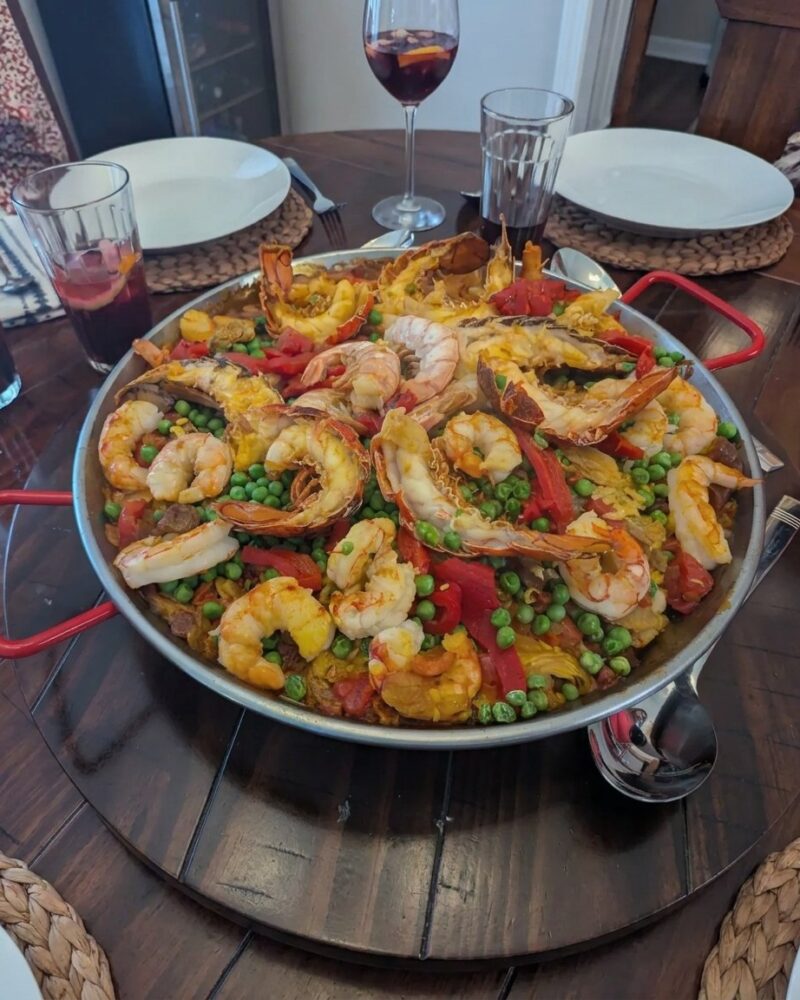 Spanish seafood paella with shrimp and mussels in a paella pan